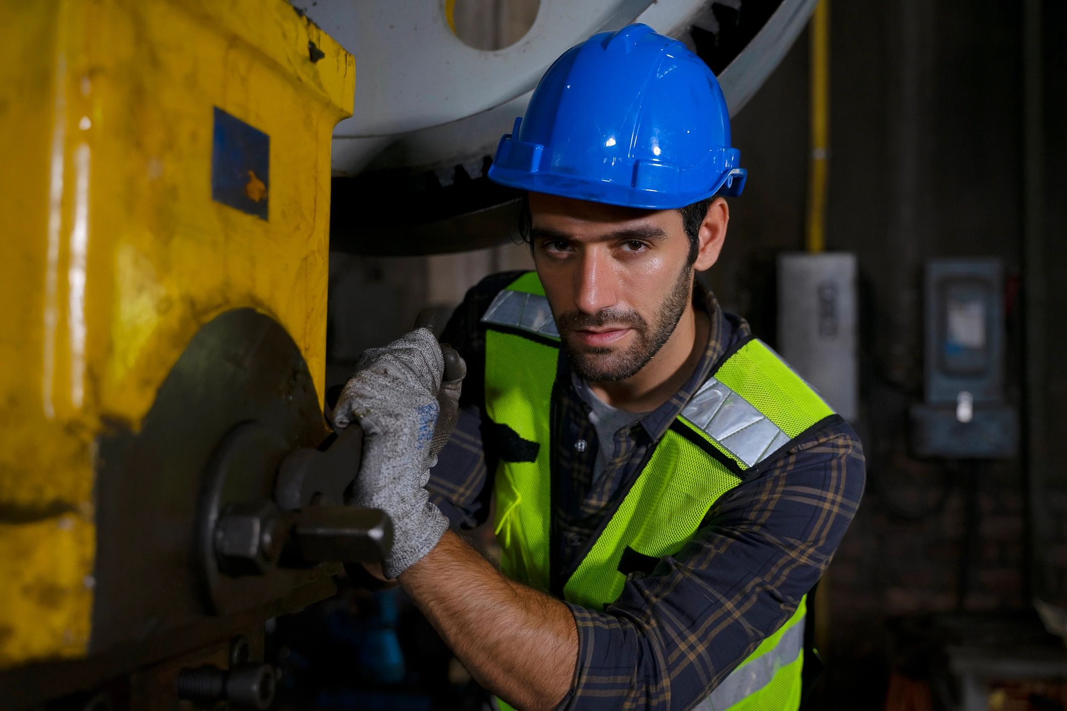Engineer reviewing machine operations on the factory floor