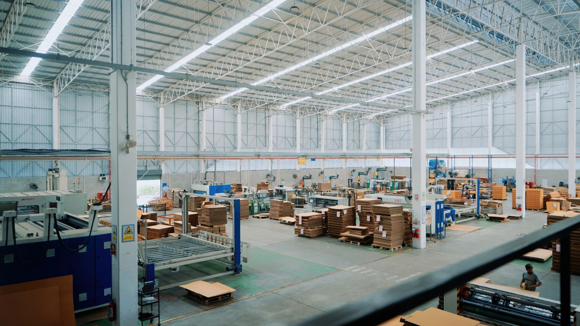 Modern factory floor with organized production and storage areas