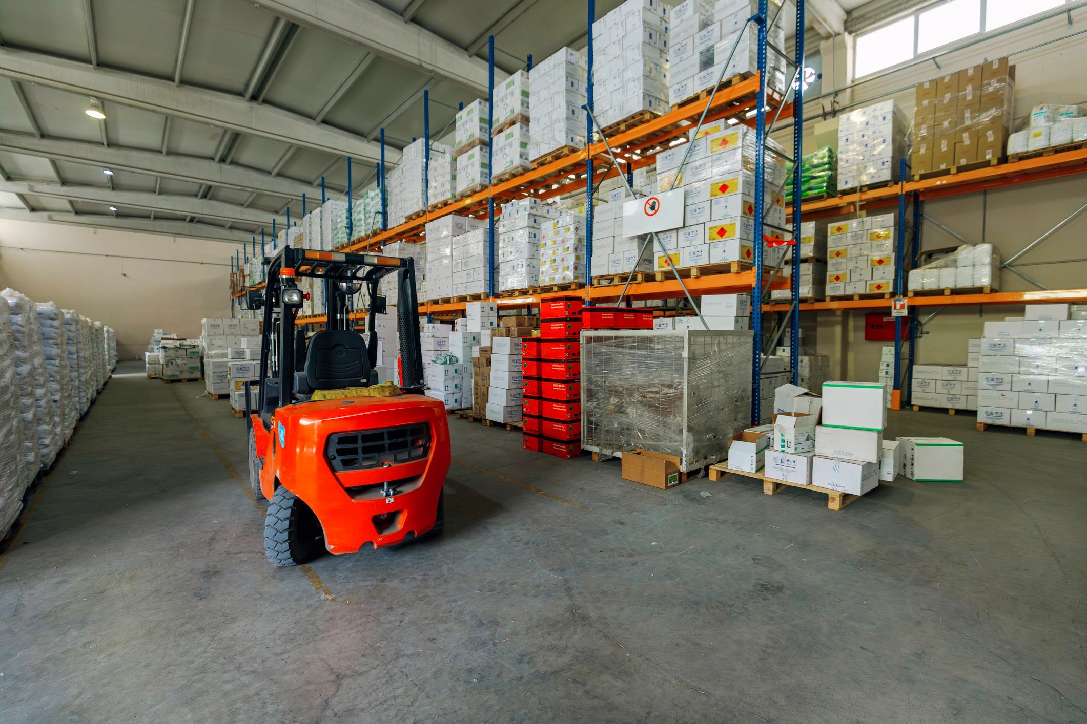 Warehouse inventory aisle supporting logistics and stock control
